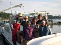 Sandy Wyllie-Echeverria (far left) and family crew with Eric Grossman (second from left) and Renee Takesue (far right).