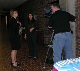 Photo of USGS hydrologist being interviewed by news media