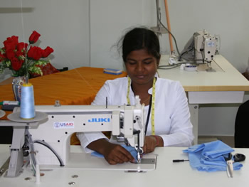 Image of a young Sri Lankan girl sewing