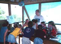 Don Hickey speaks to school children about coral reefs