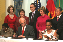 Photo of signing of declaration to fight malaria.