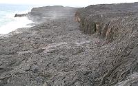 Trickles of lava onto now-covered Highcastle beach, Kilauea volcano, Hawai'i