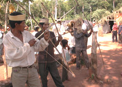 Photo of Mbya Guarani men with arrows.