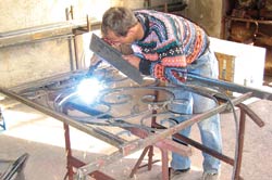 Photo of a Macedonian employee welding at an ironwork firm