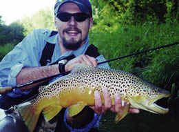 Angler with huge trout