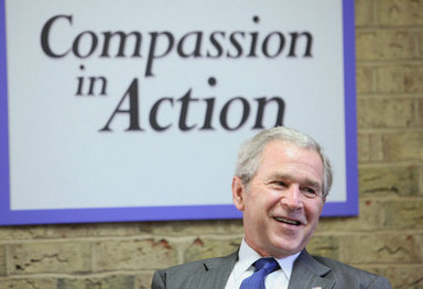 President George W. Bush listens to participants during a roundtable on mentoring children of prisoners initiative Tuesday, Dec. 2, 2008, at the Youth Focus, Inc., in Greensboro, N.C. President Bush praised the Youth Focus program for their mentoring work in helping youngsters toward a brighter future. White House photo by Chris Greenberg