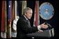 President George W. Bush gestures as he addresses his remarks on the global war on terror, Wednesday, Jan. 4, 2006, to an audience at the Pentagon, following a Department of Defense briefing with Secretary of Defense Donald Rumsfeld and Joint Chiefs of Staff General Peter Pace.  White House photo by Eric Draper