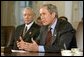 President George W. Bush addresses the media after meeting with members of Congress, including Senator Orrin Hatch of Utah, left, in the Cabinet Room Thursday, May 9. "There are 30 circuit court vacancies in America, and they've approved seven. This is a bad record, and it's a record that's bad for the country," said the President.  