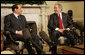 President George W. Bush smiles as he and Italian Prime Minister Silvio Berlusconi meet the media in the Oval Office Tuesday, Feb. 28, 2006. The President used the occasion to commend the Prime Minister for the stability he's brought to the Italian government and to applaud his country's recent success with the Olympic Games.  White House photo by Kimberlee Hewitt