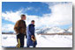 President George W. Bush and friend Roland Betts walk a private trail along the Snake River in Jackson Hole, Wyoming, Saturday, Feb. 9, 2002. The President and Mrs. Bush are staying at the Jackson Hole residence of Roland and Lois Betts. The Grand Teton Mountains are shown in background. White House photo by Eric Draper.