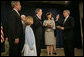 White House Chief of Staff Andrew Card swears in United States Trade Representative Rob Portman during a ceremony attended by the ambassador's family and President George W. Bush at the Dwight D. Eisenhower Executive Office Building Tuesday, May 17, 2005. White House photo by Eric Draper