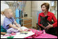 Laura Bush and her Scottish Terrier, Barney, visit with Carly Batchelder,8, a patient at Children's National Medical Center in Washington, D.C., Wednesday, Dec. 15, 2004.  White House photo by Susan Sterner