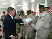 Senator Johnny Isakson gives out some gifts from home to Georgia soldiers during his trip to Iraq.