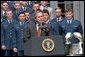 President George W. Bush speaks during the presentation of the Commander-in-Chief's Trophy to the Air Force Academy football team in the Rose Garden Friday, May 17. "During last May's visit, I said of Coach DeBerry, he is not just recruiting to win football games, he is recruiting to win our nation's war, if we have one. That was May. And on September 11th, war came to our country. And I want to thank you, Coach, for recruiting those who will help us win our nation's wars," remarked the President.  