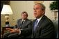 President George W. Bush meets with the Prime Minister David Oddsson of Iceland in the Oval Office Tuesday, July 6, 2004.  White House photo by Eric Draper