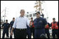 President George W. Bush stands with Admiral Thad Allen, Commandant of the U.S. Coast Guard, as he talks with reporters following his tour of the U.S. Coast Guard Integrated Support Command at the Port of Miami Monday, July 31, 2006.  White House photo by Kimberlee Hewitt