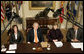 President George W. Bush, joined by Mrs. Laura Bush, talks with reporters during a briefing on volunteerism in the Roosevelt Room at the White House, Tuesday, Feb. 13, 2007, seen with Jean Case, chair of the President’s Council on Service and Civic Participation, and Bob Goodwin, president and CEO of Points of the Light Foundation and Volunteer Center National Network.  White House photo by Eric Draper