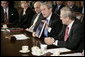 President George W. Bush holds a copy of the newly released report, The Federal Response to Hurricane Katrina: Lessons Learned, while talking to reporters at a Cabinet meeting Thursday, Feb. 23, 2006 at the White House. The report reviews the federal response to Katrina and makes recommendations about how to better respond in the future.  White House photo by Eric Draper