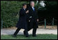 President George W. Bush and President Nicolas Sarkozy share a moment as they walk to a joint press availability Wednesday, Nov. 7, 2007, at Mount Vernon. The tour of the Virginia home of George Washington coincided with a series of meetings by the two leaders during the visit by the French leader to the United States. White House photo by Chris Greenberg