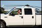 President George W. Bush waves as he drives German Chancellor Angela Merkel, Mrs. Laura Bush and Merkel’s husband, Dr. Joachim Sauer, following the Merkel’s arrival to the Bush ranch in Crawford, Texas, Friday, Nov. 9, 2007. White House photo by Shealah Craighead