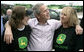 President George W. Bush offers some encouragement to two employees of the John Deere dealership in Greensburg, Kansas Wednesday, May 9, 2007, during a tour of the small, Midwest community that lost nearly 95 percent of its homes and businesses in the wake of a deadly tornado.  White House photo by Eric Draper