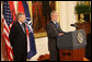 President George W. Bush is joined by NATO Secretary General Jaap De Hoop Scheffer as he addresses his remarks to invited guests Friday, Oct. 24, 2008 in the East Room of the White House, prior to signing the NATO accession protocols in support of the nations of Albania and Croatia to join the NATO alliance. White House photo by Chris Greenberg