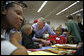 President George W. Bush greets volunteers big and small during Martin Luther King, Jr. Day at Cardozo Senior High School in Washington, D.C., Monday, Jan. 15, 2007. "One of the things that Mrs. King wanted was for MLK Day to be a day of service. It is not a day off, but it's a day on," said the President. "And so I'm here at Cardozo High School to thank the hundreds of people who have showed up to serve the country by volunteering." White House photo by Paul Morse