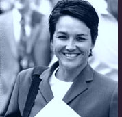 smiling professional woman with crowd in background