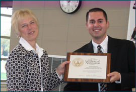 FNS Associate Administrator Eric Steiner presented a certificate to Louise Easterly, Kettering City Schools Food and Nutrition Supervisor.