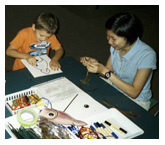 Visitors to the "In Search of Giant Squid" exhibition at Yale University's Peabody Museum make their very own giant squid puppets.