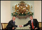 President George W. Bush and Bulgarian President Georgi Parvanov shake hands at their meeting in the Coat of Arms Hall in Sofia, Bulgaria, Monday, June 11, 2007. White House photo by Eric Draper