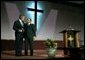 President George W. Bush embraces Pastor John K. Jenkins, Sr. of the First Baptist Church of Glenarden during an annual service honoring Dr. Martin Luther King, Jr. in Landover, Md., Monday, Jan. 20, 2003. "And even though progress has been made, Pastor -- even though progress has been made, there is more to do," said the President in his remarks. "There are still people in our society who hurt. There is still prejudice holding people back. There is still a school system that doesn't elevate every child so they can learn." White House photo by Susan Sterner.