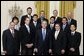 President George W. Bush stands with members of the UCLA Men's Tennis team during Championship Day Tuesday, July 12, 2005, at the White House. White House photo by David Bohrer