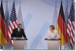 President George W. Bush and Chancellor Angela Merkel hold a joint press conference in Stralsund, Germany, Thursday, July 13, 2006. "We had a good discussion -- it's more than a discussion, it's really a strategy session, is the way I'd like to describe it," said President Bush. "We talked about a lot of subjects. We talked about the Middle East and Iran, and I briefed the Chancellor on North Korea. We talked about Iraq and Afghanistan, as well." White House photo by Paul Morse