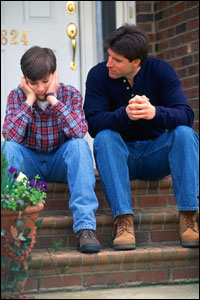 Photo: A father talking to his son.