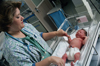 Nurse taking care of a newborn baby