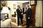 President George W. Bush welcomes U.S. Coast Guard Rear Admiral Stephen W. Rochon to the Oval Office Tuesday, Feb. 20, 2007. The New Orleans native was announced Tuesday, Feb. 27, 2007, as Director of the Executive Residence and Chief Usher. He will be the eighth Chief Usher of the White House. White House photo by Eric Draper