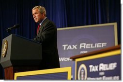 President George W. Bush speaks during the signing of H.R. 1308, the Working Families Tax Relief Act of 2004, at the South Suburban YMCA in Des Moines Iowa, Monday, Oct. 4, 2004.  White House photo by Tina Hager