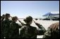 Military personnel from Nellis Air Force Base salute President George W. Bush as he boards Air Force One before departing Las Vegas, Nev., Tuesday, Sept. 14, 2004. White House photo by Eric Draper