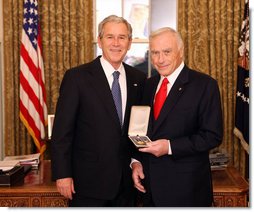 President George W. Bush stands with Arnold Fisher after presenting him with the 2008 Presidential Citizens Medal Wednesday, Dec. 10, 2008, in the Oval Office of the White House. White House photo by Chris Greenberg