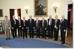 President George W. Bush and the Dr. John Marburger, far-right, director of the White House Office of Science and Technology, pose with the recipients of National Medal of Science, Monday, Feb. 13, of the White House. From left to right are Dr. Dennis P. Sullivan, Dr. Phillip A. Sharp, Dr. Robert N. Clayton, Dr. Stephen J. Lippard, Dr. Kenneth J. Arrow, Dr. Norman E. Borlaug, Dr. Edwin N. Lightfoot and Dr. Thomas E. Starzl. White House photo by Eric Draper