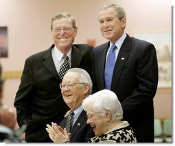 President George W. Bush and Senator Pete Domenici, R-NM., visit with breakfast guests at Bear Canyon Senior Center, Tuesday, March 22, 2005, in Albuquerque. The two visited with more than 30 seniors who were on hand to hear the president’s proposals for Social Security reform.  White House photo by Eric Draper