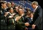 After speaking, President George W. Bush greets a few of the new employees at the U.S. Department of Homeland Security at the Ronald Reagan Building and International Trade Center in Washington, D.C., Friday, Feb. 28, 2003. White House photo by Paul Morse