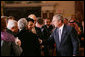 President George W. Bush speaks with U.S. Secretary of State Condoleezza Rice, center, joined by Palestinian President Mahmoud Abbas, left, and Israeli Prime Minister Ehud Olmert, following President Bush’s address at the Secretary of State’s Dinner Monday evening, Nov. 26, 2007 at the State Department in Washington, D.C., welcoming the participants attending the Annapolis Conference. White House photo by Chris Greenberg