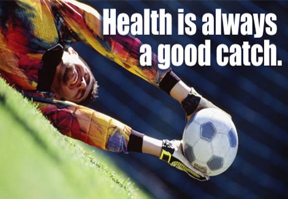 Cover Image: A soccer goalie diving to catch a soccer ball before it goes in the goal. Cover Text: Health is always a good catch. Inside text: Take daily steps to live a healthier life. Learn more about men's health (link to http://www.cdc.gov/men/tips/).