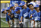 Players of the Jose M. Rodriguez Little League Angels of Manati, Puerto Rico, all look over toward President George W. Bush as he welcomes everyone to the 2008 Tee Ball on the South Lawn Season Opener Monday, June 30, 2008, on the South Lawn of the White House. White House photo by Eric Draper