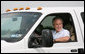 President George W. Bush smiles as NATO Secretary-General Jaap de Hoop Scheffer waves from the passenger seat Sunday after arriving at the Bush Ranch in Crawford, Texas. White House photo by Shealah Craighead