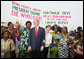 President George W. Bush and Mrs. Laura Bush pose with women at Cadjehoun International Airport in Cotonou, Benin Saturday, Feb. 16, 2008, after they greeted the President and First Lady upon arrival. White House photo by Shealah Craighead