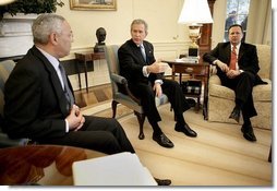 President George W. Bush talks with State Secretary Colin Powell and FEMA Director Mike Brown, far right, during an Oval Office briefing on the tsumami relief efforts Monday, Jan. 10, 2005.   White House photo by Eric Draper