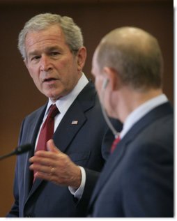 President George W. Bush looks toward President Vladimir Putin Sunday, April 6, 2008, while making remarks during a joint press availability at the State Resident of the President of Russia in Sochi.  White House photo by Chris Greenberg